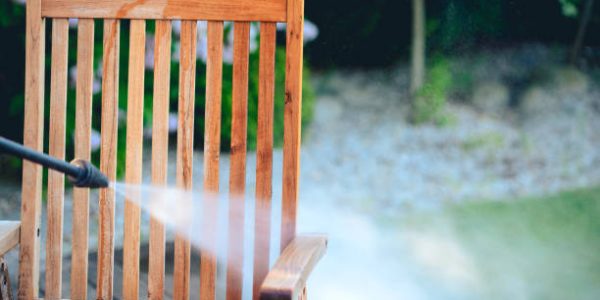 power washing garden furniture - made of exotic wood - very shallow depth of field